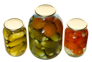 one big and two small jars with vegetables