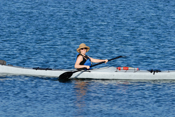 Attractive young woman in a kayak