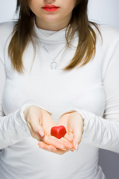 Girl holding red heart