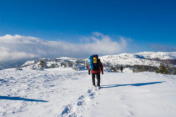 Fototapeta na wymiar Hiker are in winter in mountains