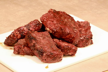 boneless barbecue ribs on cutting board