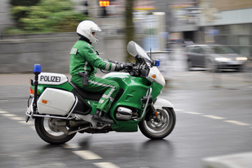 Fototapeta na wymiar Polizei Polizist Motorrad Streif Cop Bike Police