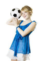 Blond girl in a blue dress with soccer ball