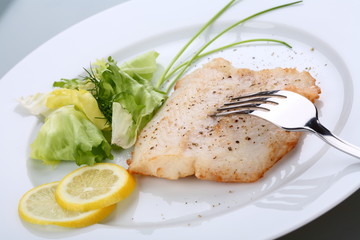 Fish dish - roasted cod with vegetable salad