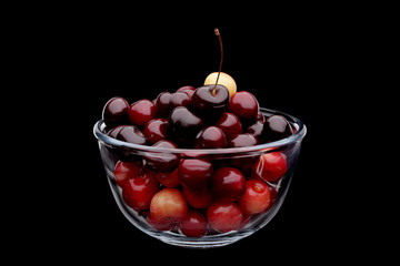 cherry in vase on black background