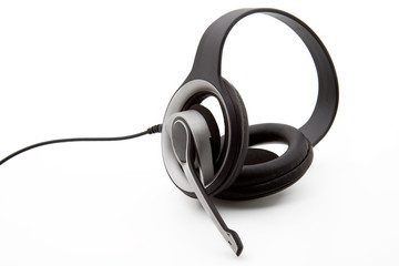 A black stereo headset isolated on a white background