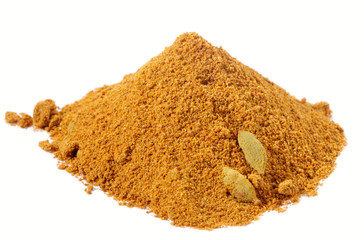 spices - pile of chicken curry over white
