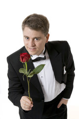 Man Holding out Rose to Camera