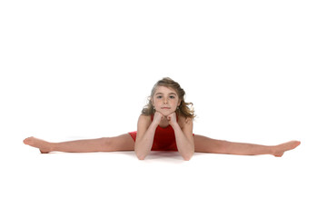 Fototapeta na wymiar young girl doing a split with her hands under her chin