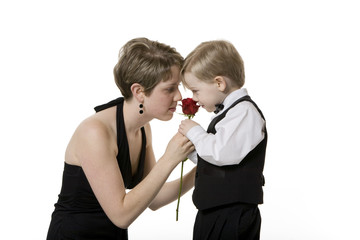 Woman and Boy Smelling a Rose Together