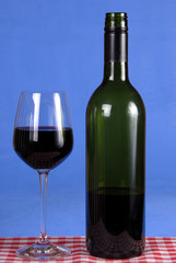 Red wine in bottle and glass