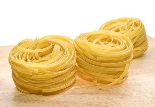 pasta tagliatelle on wood