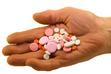 old person hand holding medicine pills