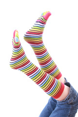 woman legs in strip sock on white background