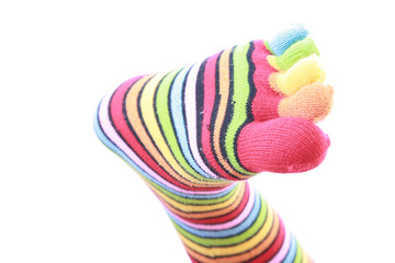 woman legs in strip sock on white background