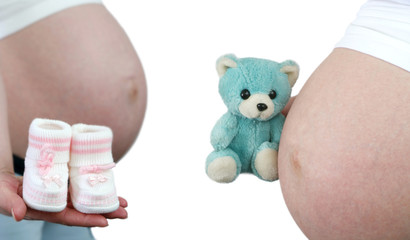 Stomach of the pregnant girl on a white background