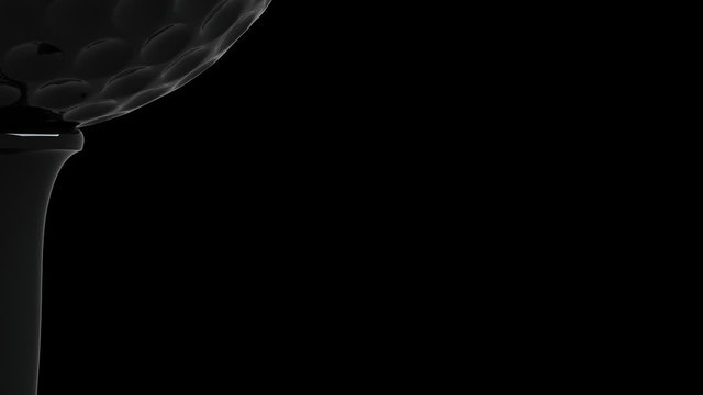 Rotating golf ball on tee in macro against black , LOOP