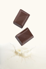chocolate falling into milk