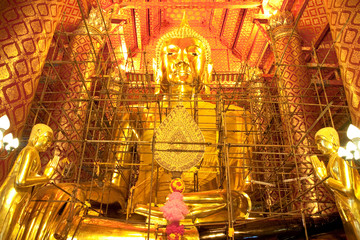 Fototapeta premium The re-painting of Buddha image, Ayutthaya province, Thailand.