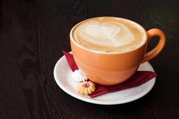 orange cup of coffe