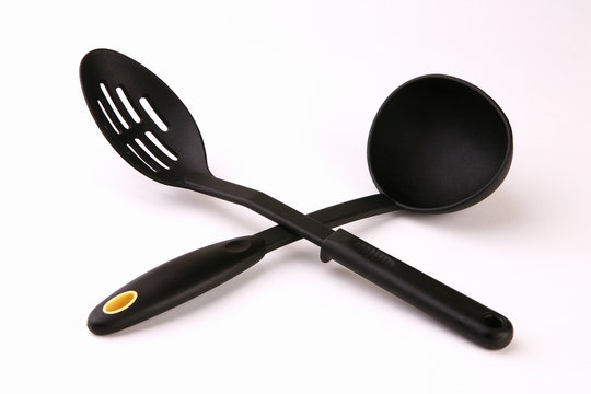 Two big black serving spoons