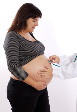 Pregnant examined by a doctor