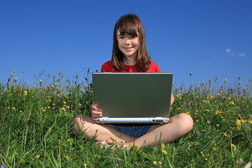 Girl using laptop outdoor
