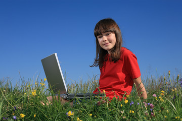 Girl using laptop outdoor