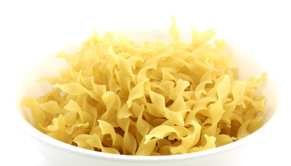 A dish of curly yellow egg noodles.