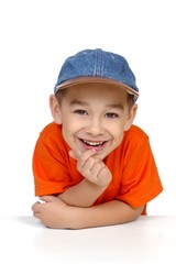 smiling boy with denim cap, isolated on white