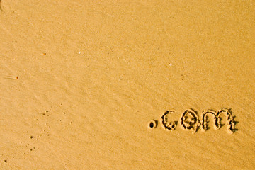 .com dans le sable