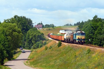 Obraz premium Freight train passes the village