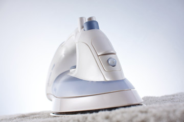 Modern iron on the towel