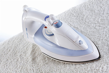 Modern iron on the towel