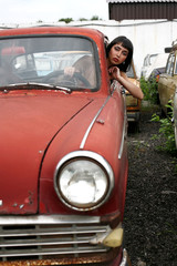 brunette in old car