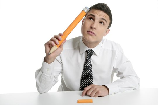 Young businessman student thinking with pencil