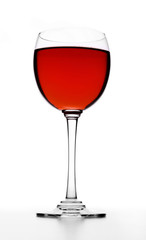 Glass of red wine on white