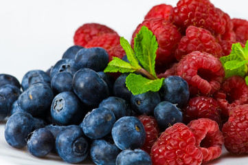 Blueberry and rasperry with mint leaves