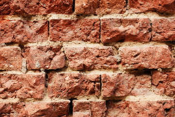 Rough wall from broken red bricks
