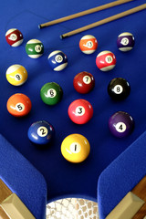 Pool balls on blue table