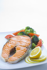 fresh salmon cooked with tomato salad broccoli salad