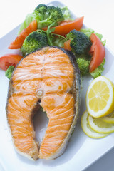 fresh salmon cooked with tomato salad broccoli salad