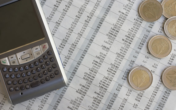 Coins on a newspaper