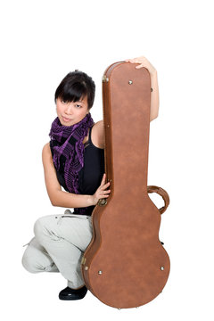 Asian Woman With Guitar Case