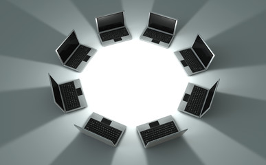Circle of laptops with blank area inside