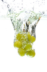 Green Grapes Splashing Into Water
