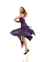 Naklejka premium Woman Dancing Dressed in Purple Dress