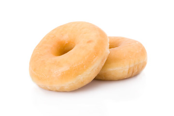 Two doughnuts or donuts piled isolated on white.