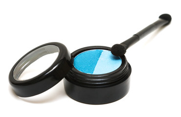 blue make-up eyeshadows and cosmetic brush