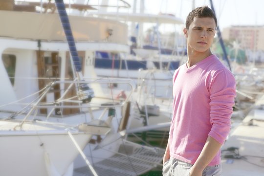 Handsome young man on summer in harbor